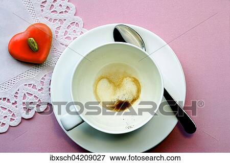 Coffee dregs in the shape of a heart, empty coffee cup, heart shaped chocolate View Large Photo Image Stock Photo - Coffee dregs in the shape of a heart, empty coffee cup, heart shaped chocolate. Fotosearch