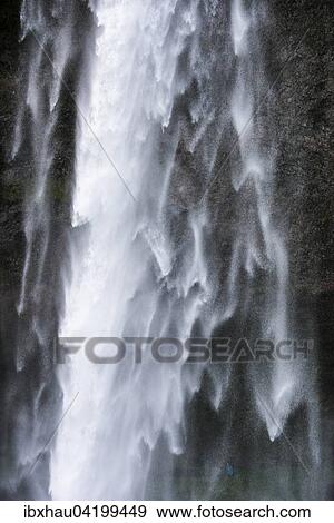 Stock Photo - Detail of the falling water in Seljalandsfoss Waterfall, Iceland, Europe. Fotosearch