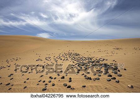 Stock Photography - Dunes, sand dunes of Maspalomas, cloud formation, black stones in the sand, nature reserve, Gran Canaria, Canary Islands, Spain, Europe. Fotosearch