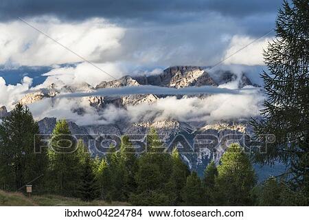 Picture - Evening sun and clouds, Sorapis group, view from the five towers area, Dolomites, Alps, Veneto, Italy, Europe. Fotosearch