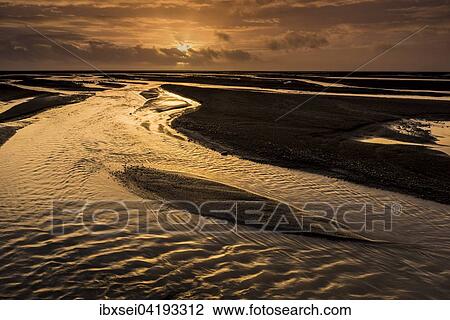 Stock Image - Glacial river Kuoafljot with reflecting water at sunset in Vik, Southern Region, Iceland, Europe. Fotosearch