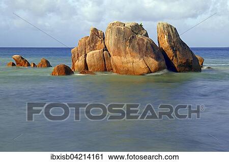 Stock Image - Granite rocks, Anse Takamaka beach, Praslin Island, Seychelles, Africa. Fotosearch