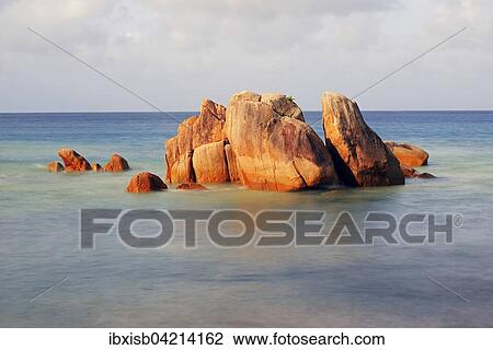 Stock Image - Granite rocks, Anse Takamaka beach, Praslin Island, Seychelles, Africa. Fotosearch