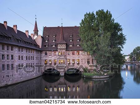 Heilig-Geist-Spital, infirmary, beside the Pegnitz river, historic centre, Nuremberg, Middle Franconia, Franconia, Bavaria, Germany, Europe View Large Photo Image Picture - Heilig-Geist-Spital, infirmary, beside the Pegnitz river, historic centre, Nuremberg, Middle Franconia, Franconia, Bavaria, Germany, Europe. Fotosearch