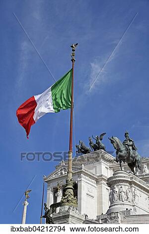 Picture - Italian flag in front of the National Monument Vittorio Emanuele II, Piazza Venezia, Rome, Lazio, Italy, Europe. Fotosearch