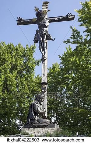 Jesus on the cross and figure of a saint, Calvary, Bad Tolz, Upper Bavaria, Bavaria, Germany, Europe View Large Photo Image Stock Image - Jesus on the cross and figure of a saint, Calvary, Bad Tolz, Upper Bavaria, Bavaria, Germany, Europe. Fotosearch