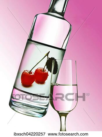 Kirsch, cherry liquor in a bottle, with a glass poured View Large Photo Image Stock Photo - Kirsch, cherry liquor in a bottle, with a glass poured. Fotosearch