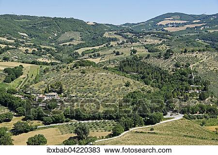 Stock Image - Landscape with a small village near Assisi, Province of Perugia, Umbria, Italy, Europe. Fotosearch
