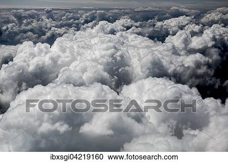 Large fluffy cumulus clouds, above the clouds, cloud cover, Germany, Europe View Large Photo Image Stock Image - Large fluffy cumulus clouds, above the clouds, cloud cover, Germany, Europe. Fotosearch