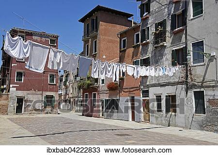 Laundry drying on clothes lines across the street, Castello district, Venice, Venezia, Veneto, Italy, Europe View Large Photo Image Stock Image - Laundry drying on clothes lines across the street, Castello district, Venice, Venezia, Veneto, Italy, Europe. Fotosearch