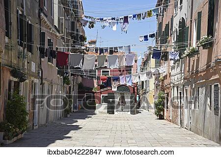 Stock Photo - Laundry drying on clothes lines across the street, Castello district, Venice, Venezia, Veneto, Italy, Europe. Fotosearch