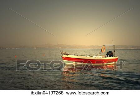 Motorboat anchored in the sea at Agia Galini, Crete, Greece, Europe View Large Photo Image Stock Photo - Motorboat anchored in the sea at Agia Galini, Crete, Greece, Europe. Fotosearch