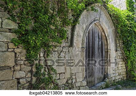 Stock Photography - Old wooden door, Medieval village of Oppede-le-Vieux, Vaucluse, Provence Alpes Cote d'Azur, France, Europe. Fotosearch