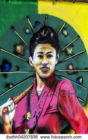 Painted image of a traditionally dressed woman on a house wall, district Kampung Bakar Batu, Malacca or Melaka, Malaysia, Asia View Large Photo Image Stock Photograph - Painted image of a traditionally dressed woman on a house wall, district Kampung Bakar Batu, Malacca or Melaka, Malaysia, Asia. Fotosearch