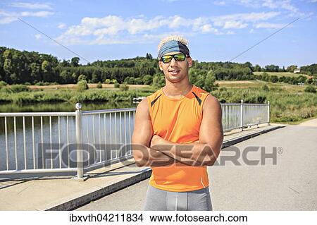 Portrait of a young, sporty man, wearing sportswear View Large Photo Image Picture - Portrait of a young, sporty man, wearing sportswear. Fotosearch
