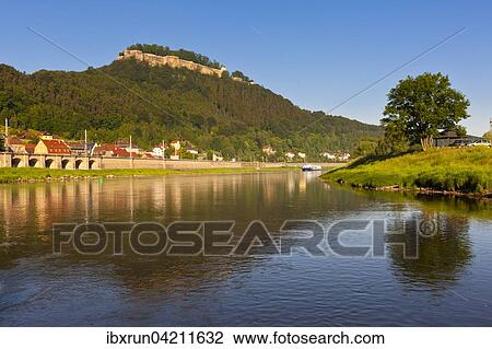 Stock Image - River Elbe and Konigstein Fortress at sunrise, Saxony Switzerland, Germany, Europe. Fotosearch