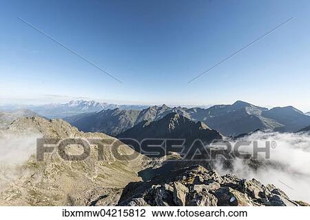 Rocky mountains with clouds, view from Greifenberg at 2618m, Schladming Tauern, Alps, Styria, Austria, Europe View Large Photo Image Stock Image - Rocky mountains with clouds, view from Greifenberg at 2618m, Schladming Tauern, Alps, Styria, Austria, Europe. Fotosearch