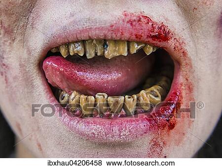 Stock Photo - Rotten zombie teeth, mouth and tongue, film shoot, scene from a zombie comedy, short film Brain Freeze. Fotosearch