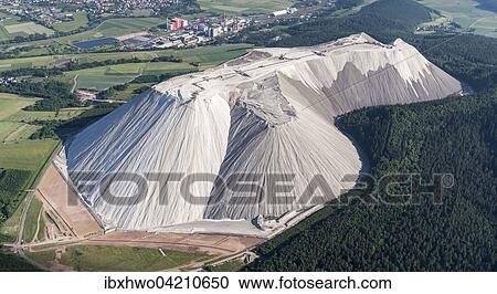Stock Image - Salt mountain, Monte Kali, Wintershall potash plant behind, K + S KALI GmbH, Werra valley, Aerial View, herring, Werra, Hessen, Germany, Europe. Fotosearch