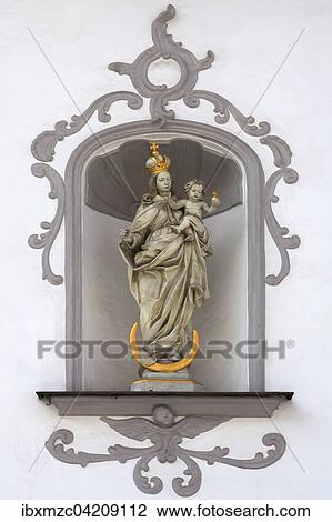 Sculpture of the Virgin Mary holding infant Jesus, in an alcove in a 1772 Mansion, Georgenstrasse 33, Amberg, Upper Palatinate, Bavaria, Germany, Europe View Large Photo Image Stock Image - Sculpture of the Virgin Mary holding infant Jesus, in an alcove in a 1772 Mansion, Georgenstrasse 33, Amberg, Upper Palatinate, Bavaria, Germany, Europe. Fotosearch