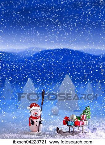 Snowman with Santa hat and sleigh, with presents, in the snow, snowflakes View Large Photo Image Stock Image - Snowman with Santa hat and sleigh, with presents, in the snow, snowflakes. Fotosearch