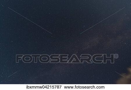Stock Photo - Starry sky with milky way at night in the Schladming Tauern, Alps, Styria, Austria, Europe. Fotosearch