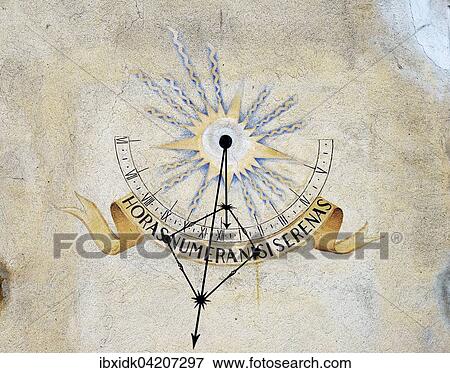 Stock Photo - Sundial showing 12: 30, on a wall, Canton of Graubunden, Switzerland, Europe. Fotosearch