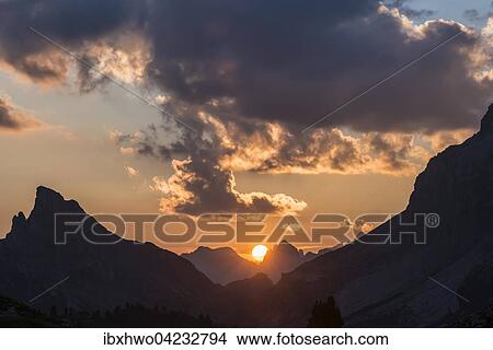 Sunset at Valparola, Hexenberg with summit cross on the left, small Lagazuoi on the right, Dolomites, Alps, Cortina d'Ampezzo, Veneto, Veneto, Italy, Europe View Large Photo Image Picture - Sunset at Valparola, Hexenberg with summit cross on the left, small Lagazuoi on the right, Dolomites, Alps, Cortina d'Ampezzo, Veneto, Veneto, Italy, Europe. Fotosearch