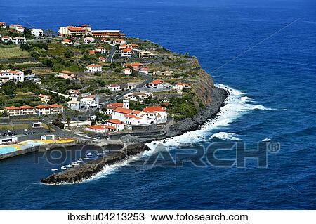 Stock Image - View of the town and harbor, north coast, Ponta Delgada, Madeira, Portugal, Europe. Fotosearch