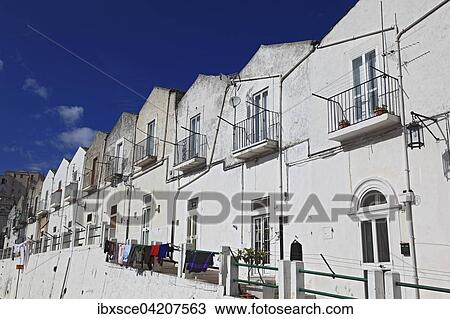 White houses along the road, Monte Sant Angelo, Gargano, Apulia, Italy, Europe View Large Photo Image Stock Image - White houses along the road, Monte Sant Angelo, Gargano, Apulia, Italy, Europe. Fotosearch