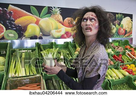 Zombie buying vegetables, scene from zombie comedy short film Brain Freeze View Large Photo Image Picture - Zombie buying vegetables, scene from zombie comedy short film Brain Freeze. Fotosearch