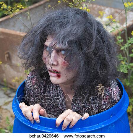 Zombie in a rain barrel, film shooting, scene from a zombie comedy, short film Brain Freeze View Large Photo Image Stock Image - Zombie in a rain barrel, film shooting, scene from a zombie comedy, short film Brain Freeze. Fotosearch