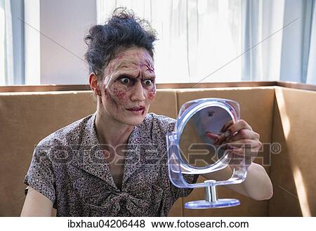 Zombie looks in the mirror, shocked, scene from zombie comedy short film Brain Freeze View Large Photo Image Stock Photo - Zombie looks in the mirror, shocked, scene from zombie comedy short film Brain Freeze. Fotosearch