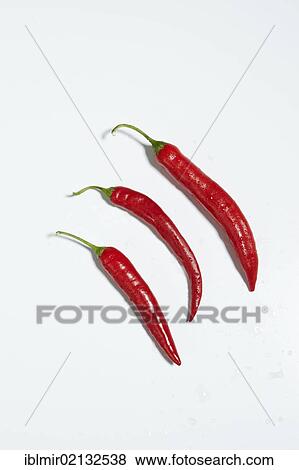Stock Photo - 3 red peppers. Fotosearch