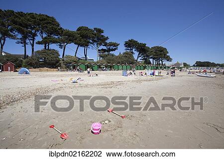Abandoned toy bucket and spades on Mudeford beach with pine trees and beach huts, Mudeford, Dorset, England, United Kingdom, Europe View Large Photo Image Stock Image - Abandoned toy bucket and spades on Mudeford beach with pine trees and beach huts, Mudeford, Dorset, England, United Kingdom, Europe. Fotosearch