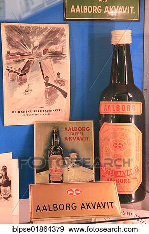 Stock Photo - Advertising signs and old Akvavit bottle, Aalborg Akvavit spirits factory, Aalborg, North Jutland, Denmark, Europe. Fotosearch