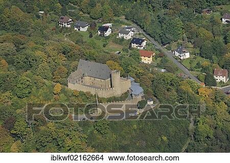 Aerial view of Schloss Biedenkopf Castle with the Hinterland Museum in Palas, bergfried, castle walls and castle terraces, Hinterland, district of Marburg-Biedenkopf, Hesse, Germany, Europe View Large Photo Image Picture - Aerial view of Schloss Biedenkopf Castle with the Hinterland Museum in Palas, bergfried, castle walls and castle terraces, Hinterland, district of Marburg-Biedenkopf, Hesse, Germany, Europe. Fotosearch