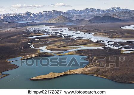 Aerial view of the colourful mountains and waters between the waterways of the Tungna River and Lake Langisjoer, between Landmannalaugar and Lakagigar, Craters of Laki, interior highlands of Iceland, Europe View Large Photo Image Stock Photo - Aerial view of the colourful mountains and waters between the waterways of the Tungna River and Lake Langisjoer, between Landmannalaugar and Lakagigar, Craters of Laki, interior highlands of Iceland, Europe. Fotosearch