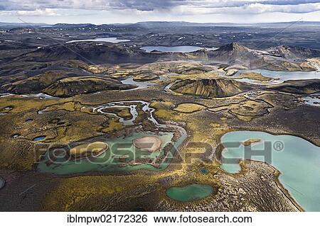 Aerial view of the colourful mountains and waters between the waterways of the Tungna River and Lake Langisjoer, between Landmannalaugar and Lakagigar, Craters of Laki, interior highlands of Iceland, Europe View Large Photo Image Stock Photograph - Aerial view of the colourful mountains and waters between the waterways of the Tungna River and Lake Langisjoer, between Landmannalaugar and Lakagigar, Craters of Laki, interior highlands of Iceland, Europe. Fotosearch