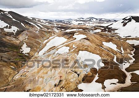 Aerial view of the snow-covered, coloured rhyolite mountains in the geothermal area of the Kerlingarfjoell Glacier, interior highlands of Iceland, Europe View Large Photo Image Stock Image - Aerial view of the snow-covered, coloured rhyolite mountains in the geothermal area of the Kerlingarfjoell Glacier, interior highlands of Iceland, Europe. Fotosearch