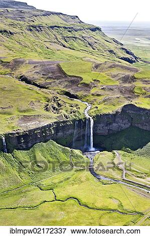 Aerial view, Seljalandsfoss waterfall on the edge of the highlands of Iceland, Europe View Large Photo Image Stock Photo - Aerial view, Seljalandsfoss waterfall on the edge of the highlands of Iceland, Europe. Fotosearch