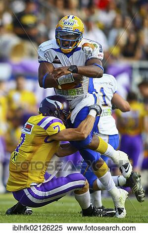 American Football, QB Chris Gunn, No. 12 of Giants, being tackled by DB Johannes Neusser, No. 7 of the Vikings; Vienna Vikings win against Graz Giants 19: 14, Vienna, Austria, Europe View Large Photo Image Stock Photography - American Football, QB Chris Gunn, No. 12 of Giants, being tackled by DB Johannes Neusser, No. 7 of the Vikings; Vienna Vikings win against Graz Giants 19: 14, Vienna, Austria, Europe. Fotosearch