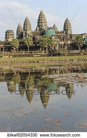 Stock Image - Angkor Wat temple complex, with reflection in the water, Siam Reap, Cambodia, Southeast Asia, Asia. Fotosearch