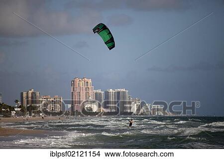 Apartment buildings and a kitesurfer on the long sandy beach of Fort Lauderdale, Broward County, Florida, USA, North America View Large Photo Image Picture - Apartment buildings and a kitesurfer on the long sandy beach of Fort Lauderdale, Broward County, Florida, USA, North America. Fotosearch