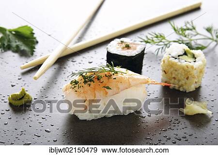 Assorted sushi with ginger and wasabi on a stone surface View Large Photo Image Stock Photo - Assorted sushi with ginger and wasabi on a stone surface. Fotosearch