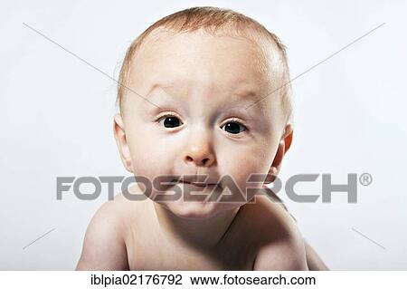 Stock Image - Baby boy, 8 months, portrait. Fotosearch