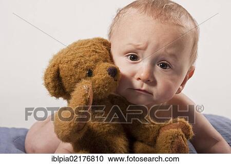 Baby boy, 8 months, with a teddy bear View Large Photo Image Stock Image - Baby boy, 8 months, with a teddy bear. Fotosearch