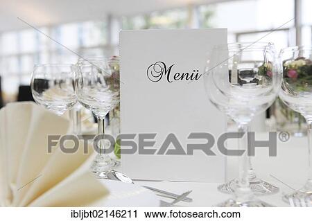 Banquet, dinner table, table decorated for a celebration with a menu card View Large Photo Image Stock Image - Banquet, dinner table, table decorated for a celebration with a menu card. Fotosearch