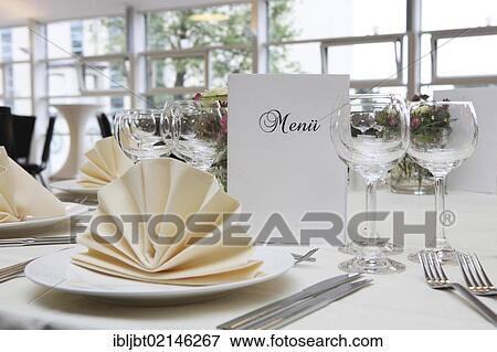 Banquet, dinner table, table decorated for a celebration with a menu card View Large Photo Image Stock Photo - Banquet, dinner table, table decorated for a celebration with a menu card. Fotosearch