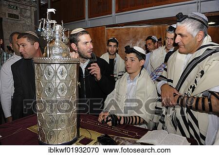 Stock Image - Bar Mitzvar, Jewish coming of age ritual, public reading from the books of the Prophets, Haftarah, Western Wall or Wailing Wall, Old City of Jerusalem, Arab Quarter, Jerusalem, Israel, Middle East, Asia. Fotosearch